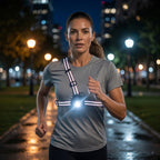 Woman running at night wearing a LUMEFIT hands-free chest light with reflective running harness